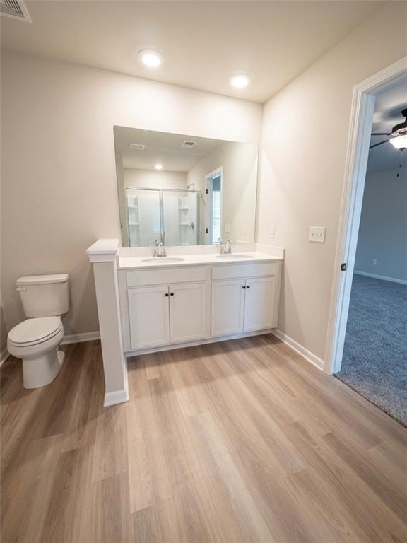 11644 Stovall Place Hampton, GA 30228 - Photo 14 of 18 a bathroom with a sink and a toilet