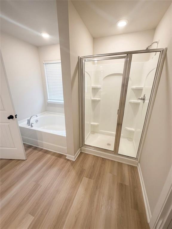 11644 Stovall Place Hampton, GA 30228 - Photo 15 of 18 a view of an empty room with wooden floor and a window