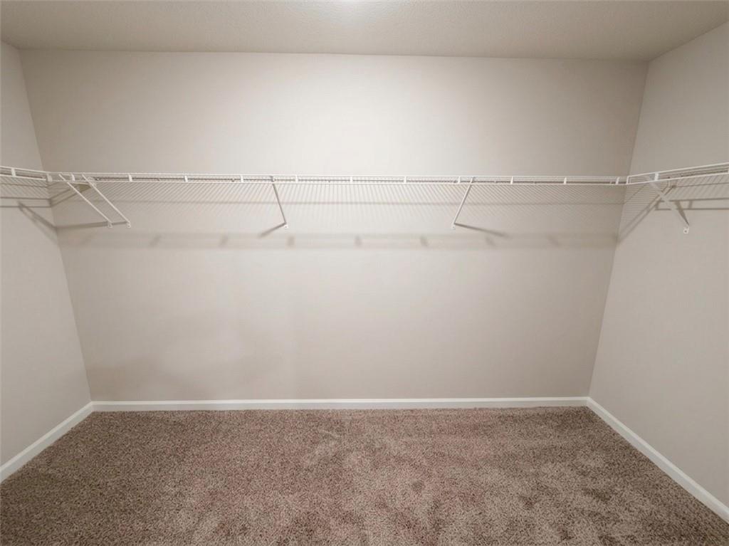 11644 Stovall Place Hampton, GA 30228 - Photo 17 of 18 a view of a room with racks on the wall