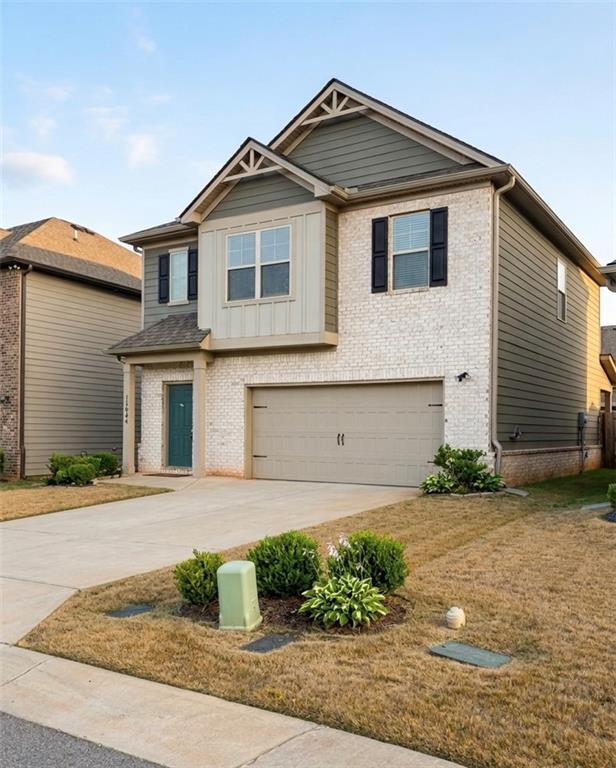 11644 Stovall Place Hampton, GA 30228 - Photo 2 of 18 a front view of a house with garden