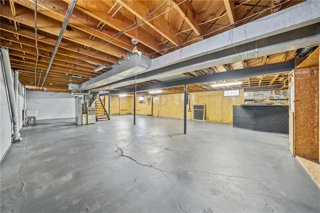 a view of an empty room with a fireplace