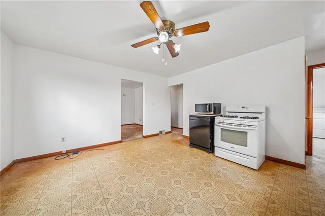 a view of a kitchen with a stove cabinets and furniture
