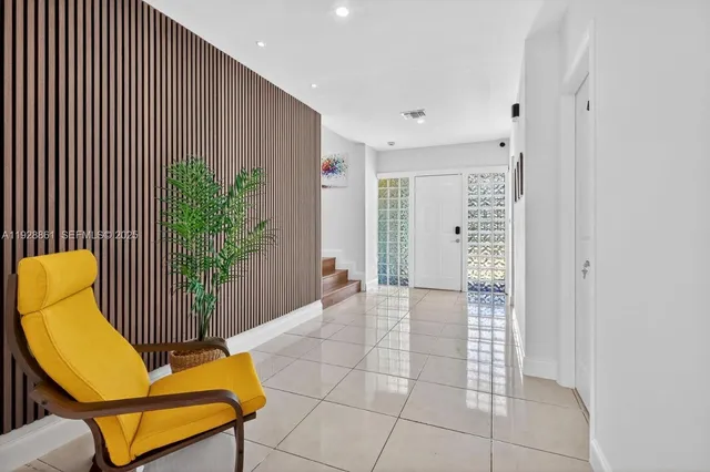a view of a livingroom with furniture and front door