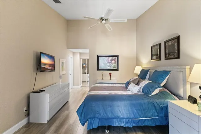 a living room with furniture kitchen view and a flat screen tv