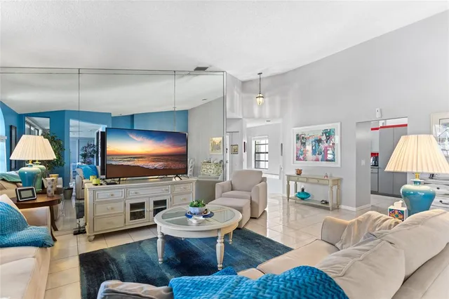 an aerial view of residential houses with outdoor space and swimming pool