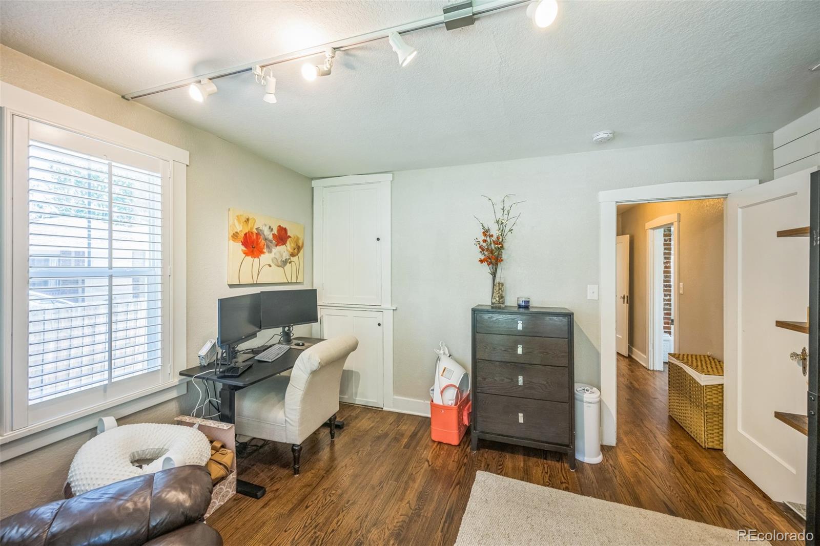 7340 West 32nd Avenue Wheat Ridge, CO 80033 - Photo 11 of 35 a living room with furniture and wooden floor