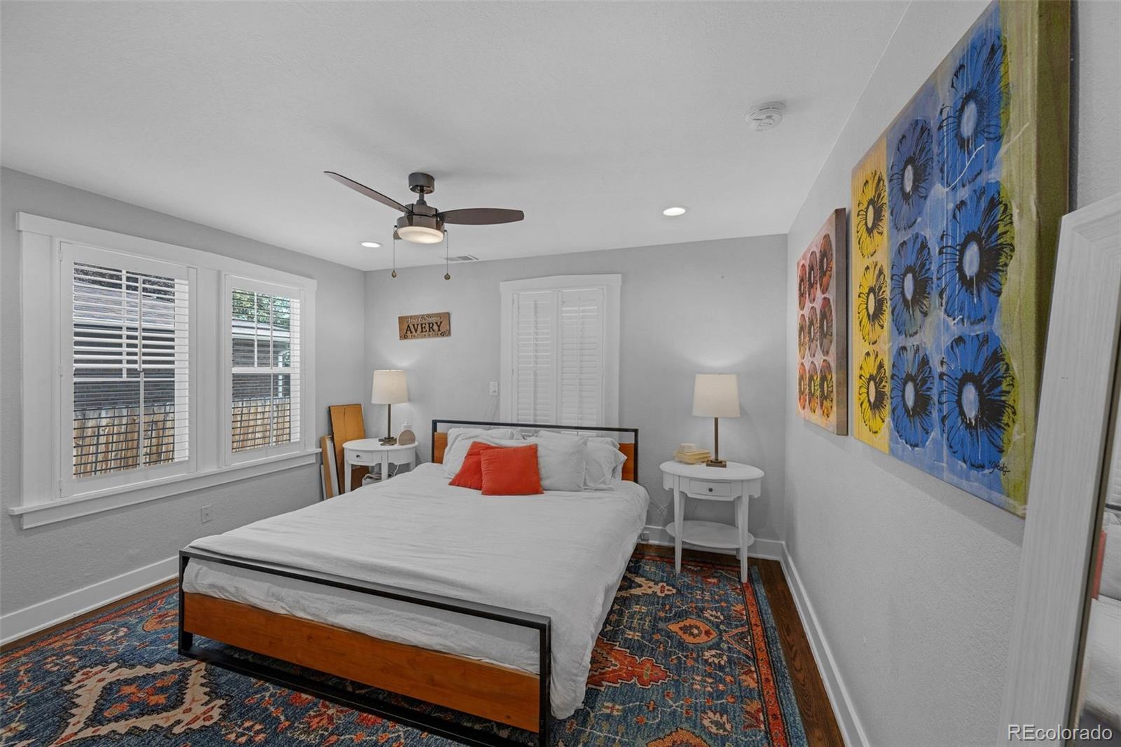 7340 West 32nd Avenue Wheat Ridge, CO 80033 - Photo 12 of 35 a bed sitting in a room next to a window