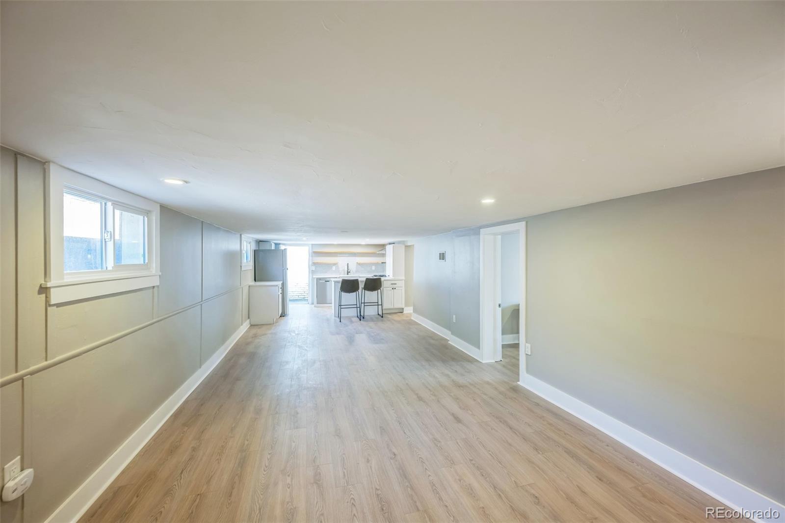 7340 West 32nd Avenue Wheat Ridge, CO 80033 - Photo 19 of 35 a view of empty room with wooden floor