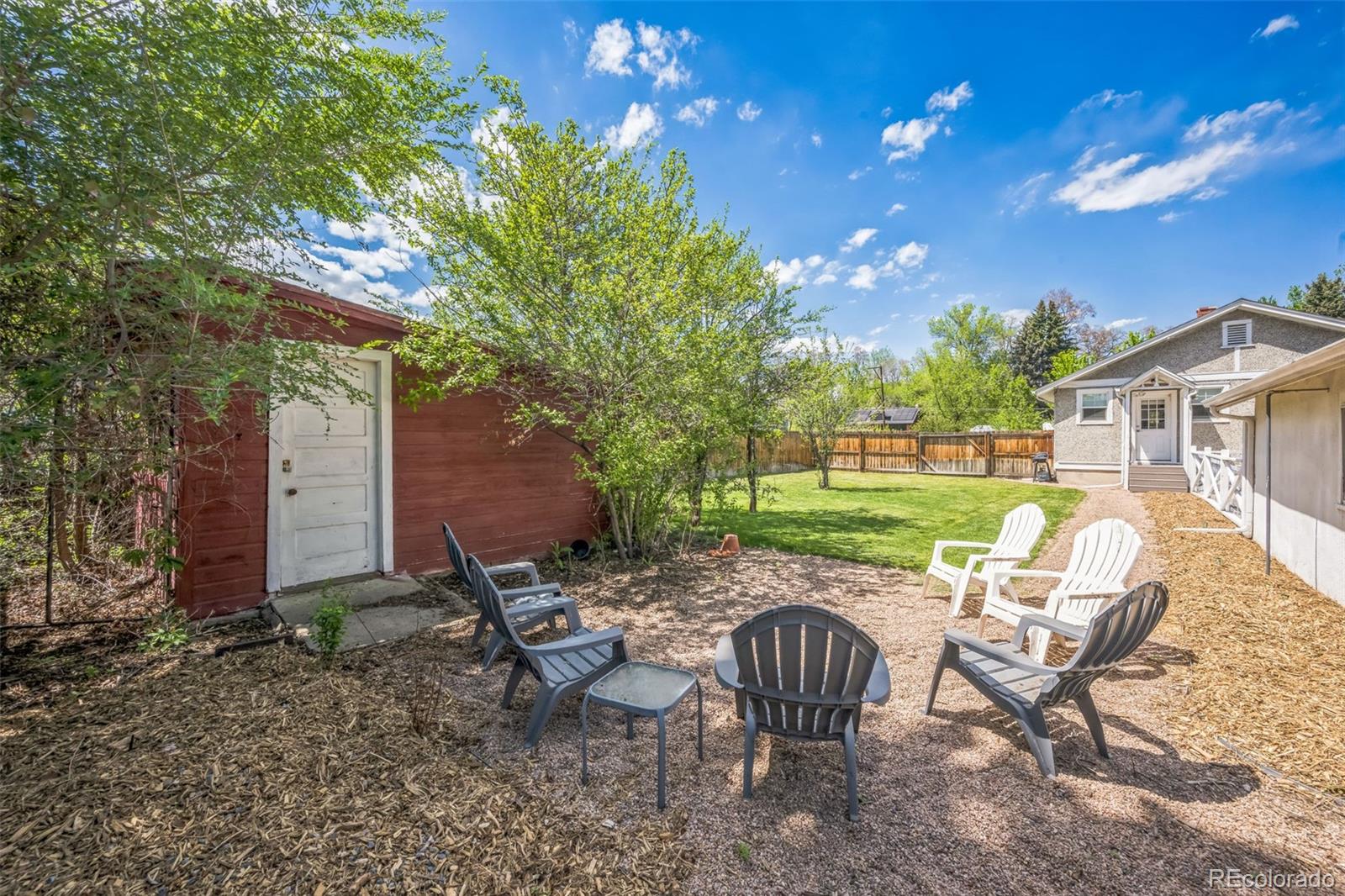 7340 West 32nd Avenue Wheat Ridge, CO 80033 - Photo 27 of 35 a view of a chairs and table in backyard