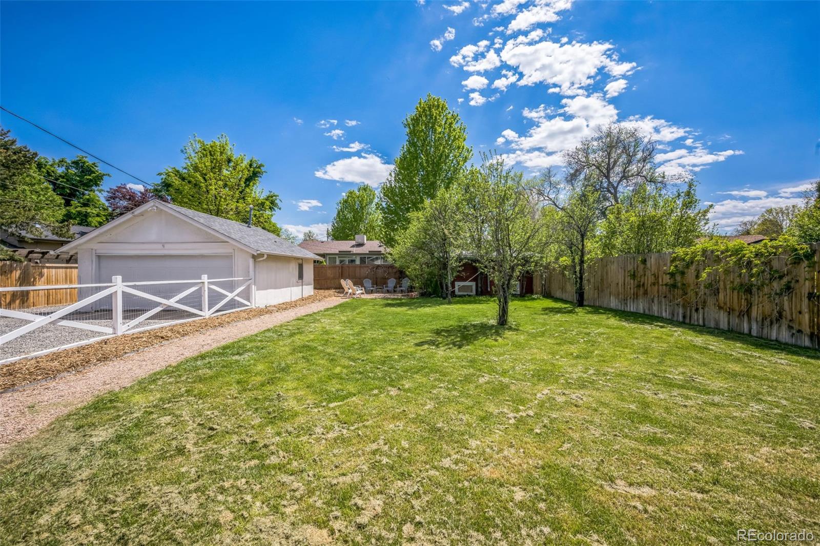 7340 West 32nd Avenue Wheat Ridge, CO 80033 - Photo 29 of 35 a front view of a house with a yard