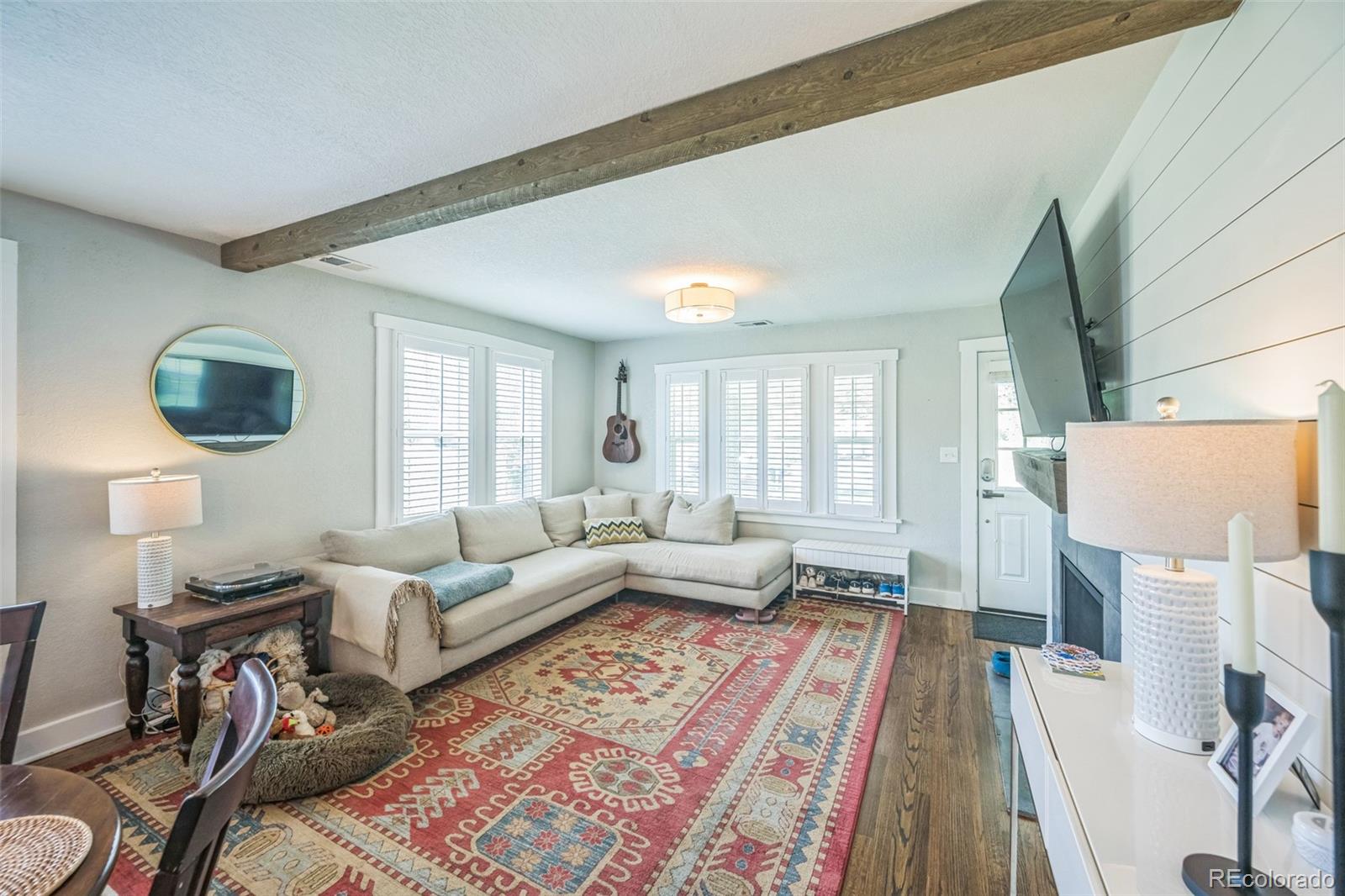 7340 West 32nd Avenue Wheat Ridge, CO 80033 - Photo 3 of 35 a living room with furniture and a rug
