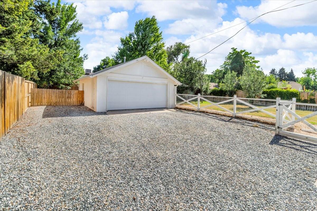 7340 West 32nd Avenue Wheat Ridge, CO 80033 - Photo 31 of 35 a view of a house with a yard and sitting area