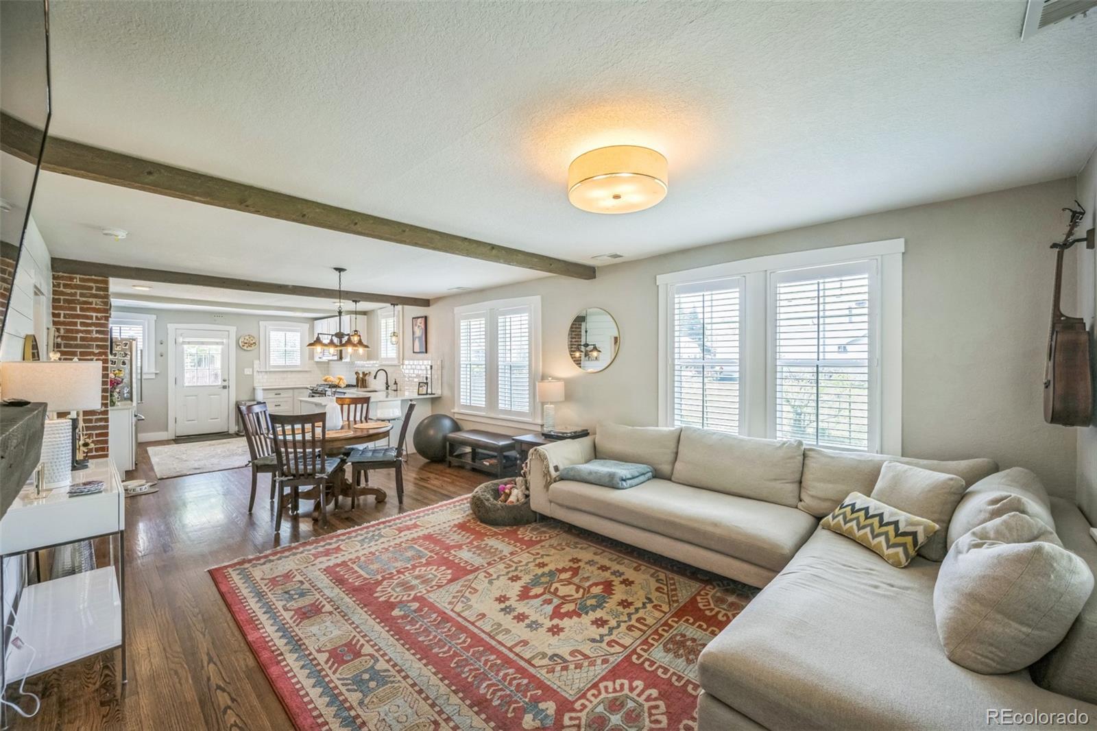 7340 West 32nd Avenue Wheat Ridge, CO 80033 - Photo 4 of 35 a living room with furniture and wooden floor