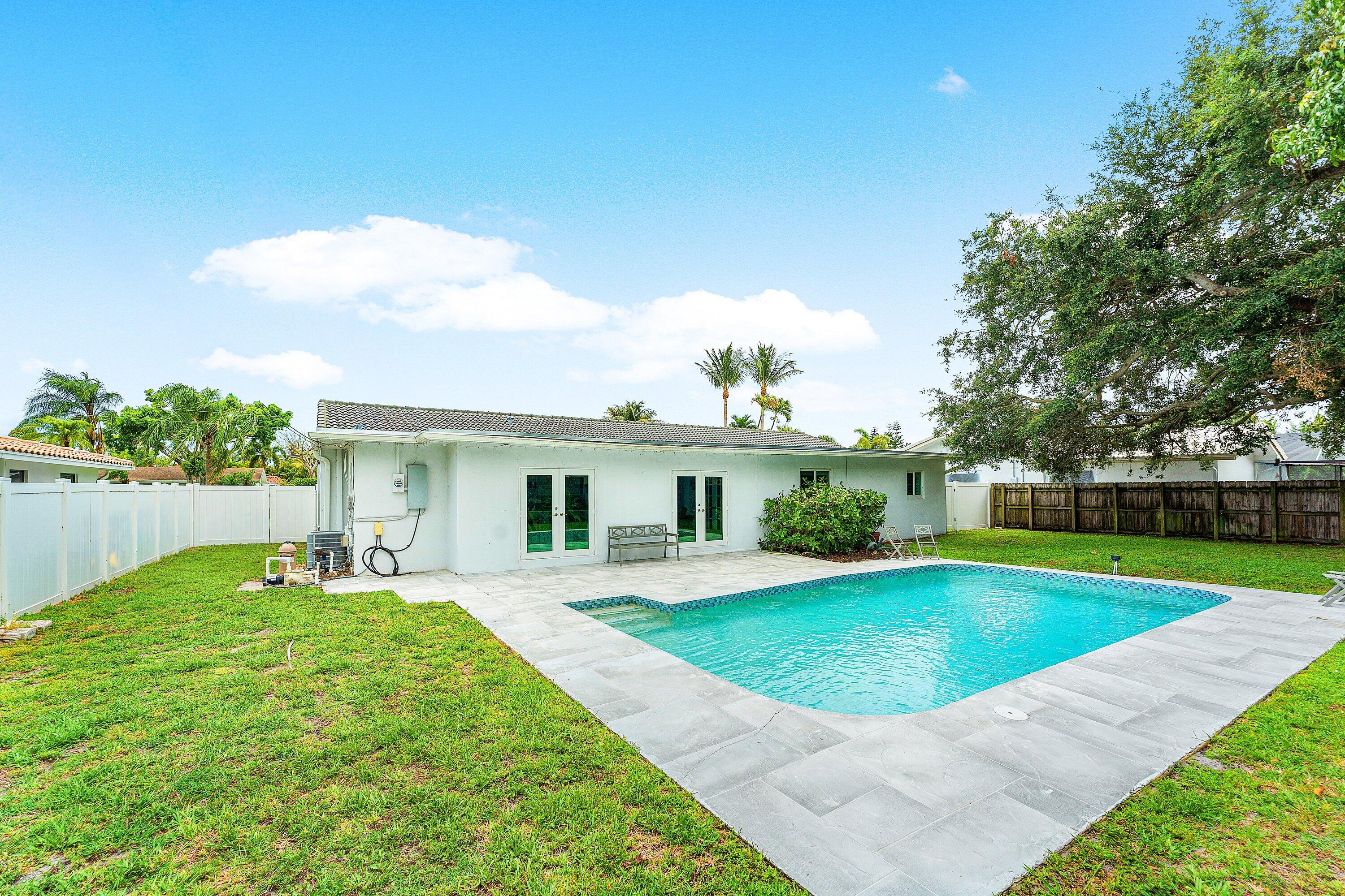 581 Northwest 13th Drive Boca Raton, FL 33486 - Photo 37 of 39 a view of a backyard with a garden and plants