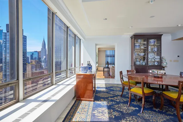 a view of a dining room with furniture and window