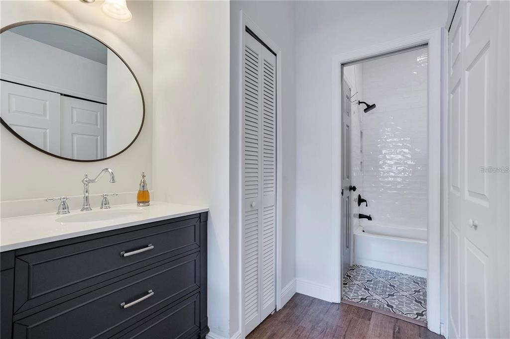 7736 Windbreak Road Orlando, FL 32819 - Photo 26 of 43 a bathroom with a sink a toilet and shower