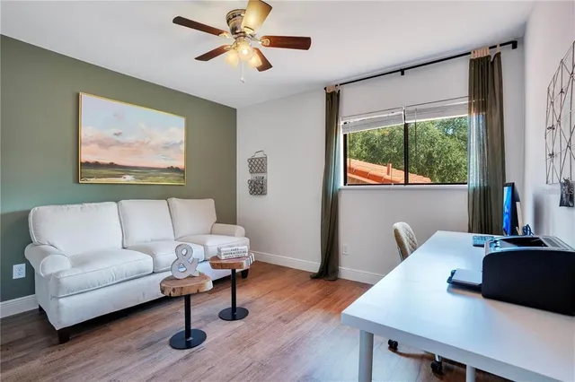 a living room with furniture and a window