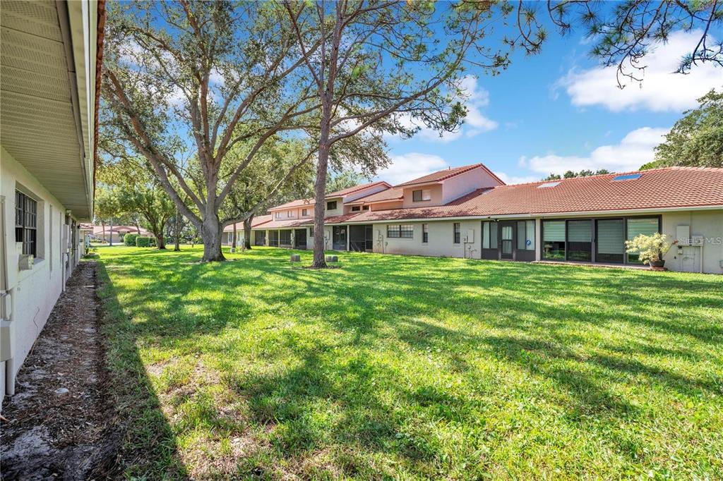 7736 Windbreak Road Orlando, FL 32819 - Photo 35 of 43 a front view of a house with a yard