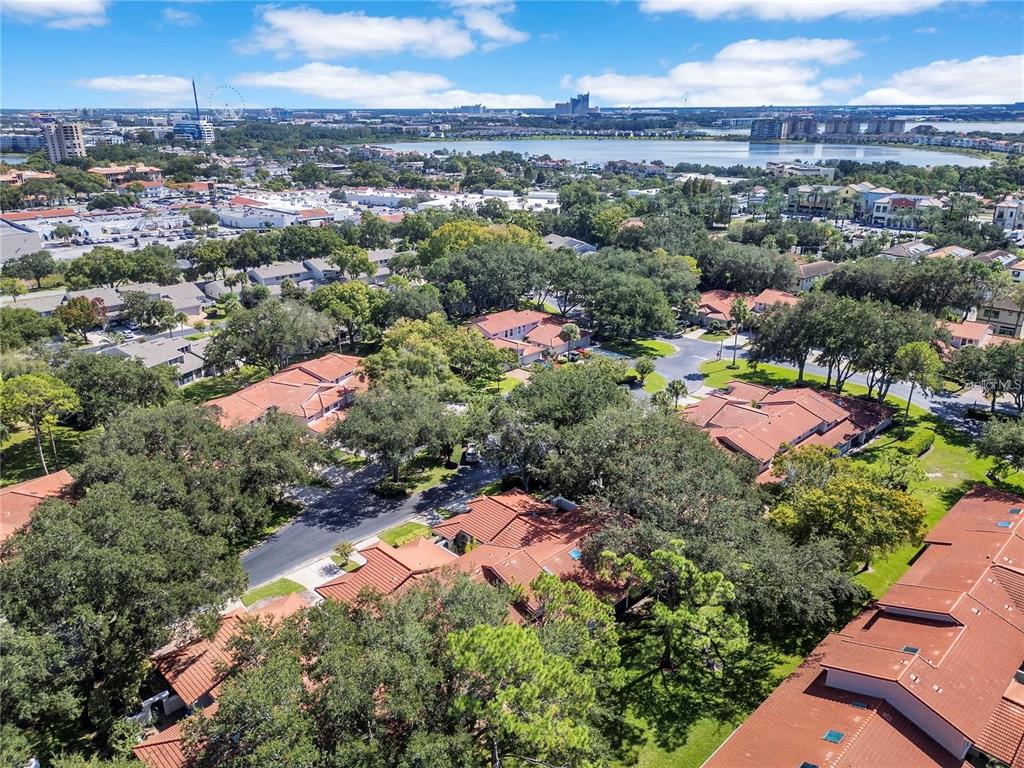 7736 Windbreak Road Orlando, FL 32819 - Photo 38 of 43 an aerial view of residential houses with outdoor space and trees