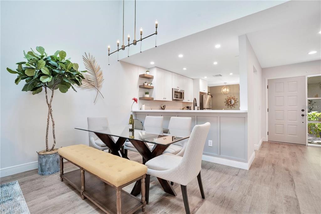 7736 Windbreak Road Orlando, FL 32819 - Photo 10 of 43 a kitchen with a table and chairs in it