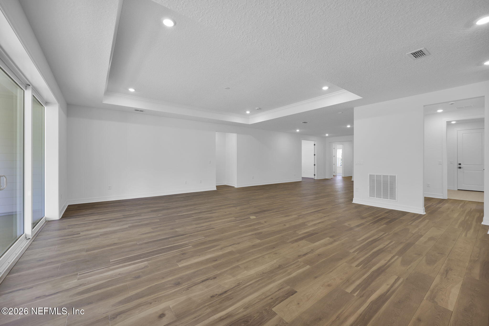 4896 Shell Crk Trail Jacksonville, FL 32226 - Photo 15 of 27 a view of an empty room with wooden floor