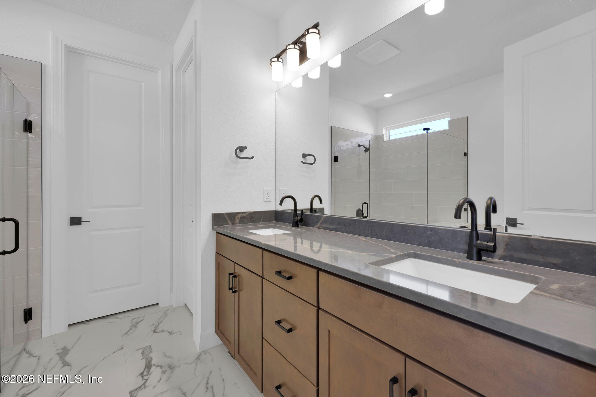 4896 Shell Crk Trail Jacksonville, FL 32226 - Photo 20 of 27 a bathroom with a sink and a mirror