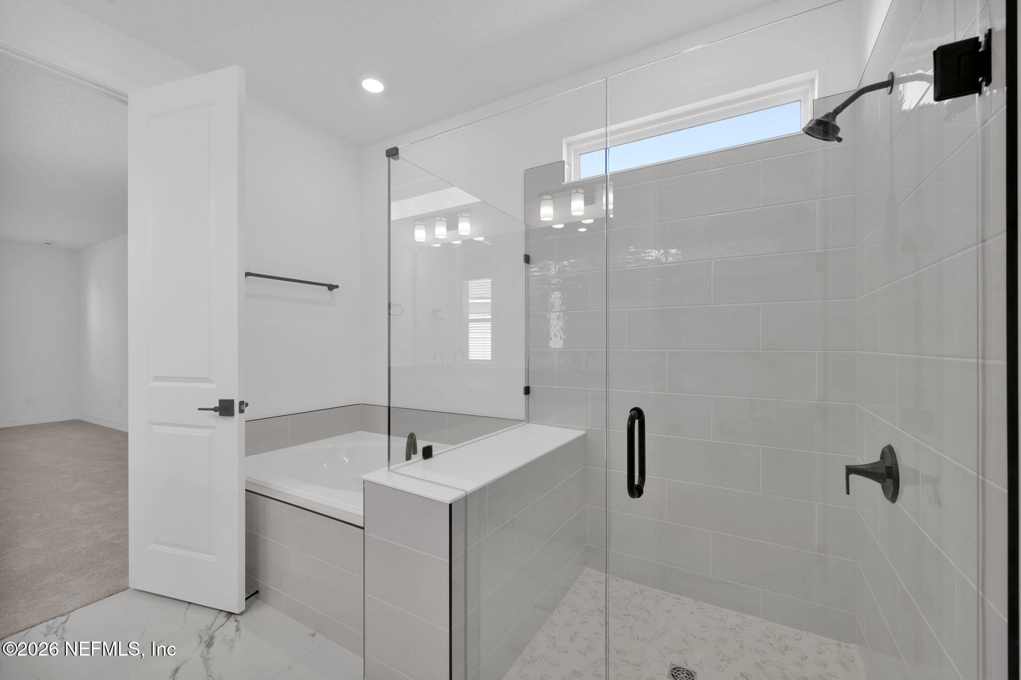 4896 Shell Crk Trail Jacksonville, FL 32226 - Photo 21 of 27 a bathroom with a sink a mirror and shower