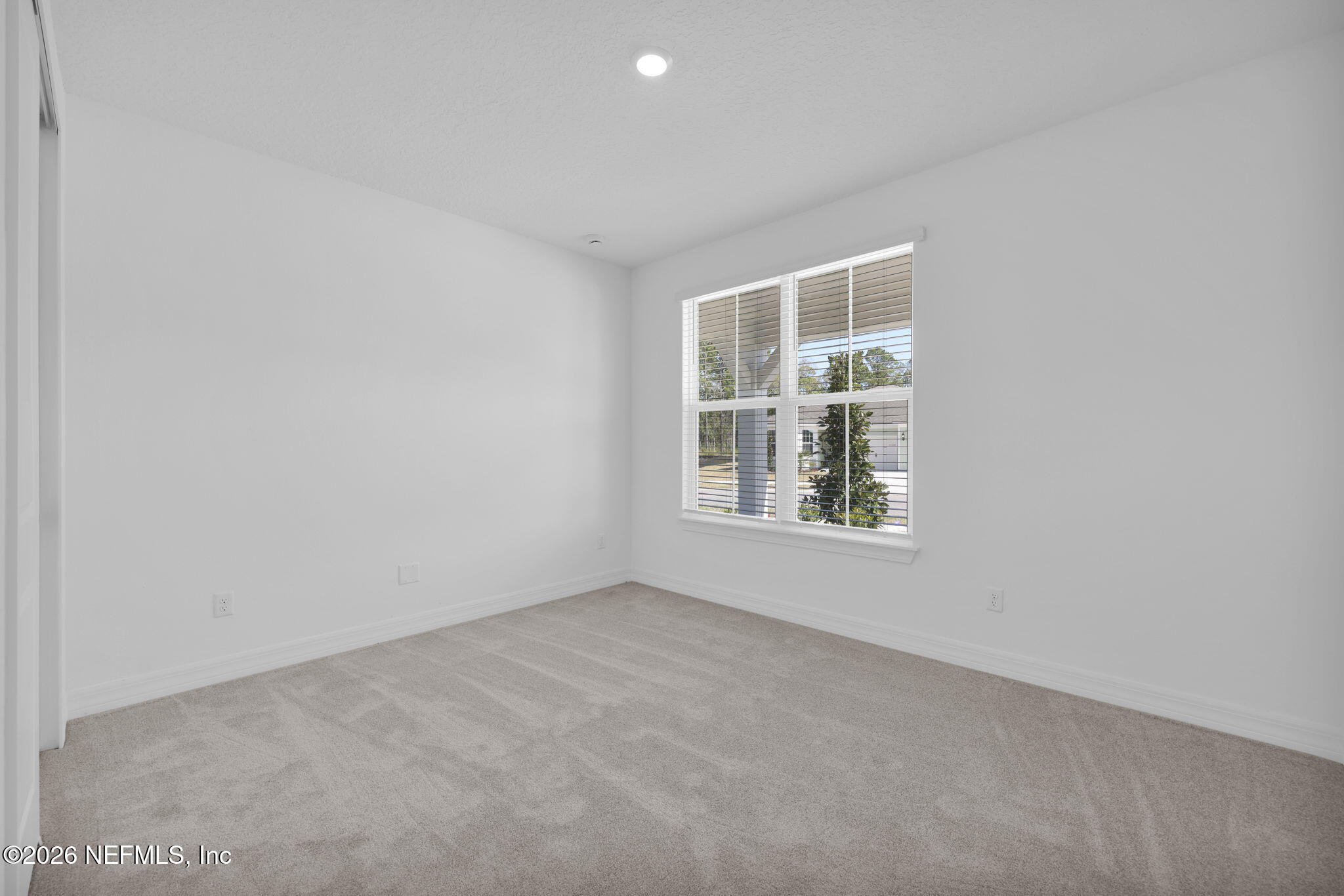 4896 Shell Crk Trail Jacksonville, FL 32226 - Photo 22 of 27 an empty room with windows