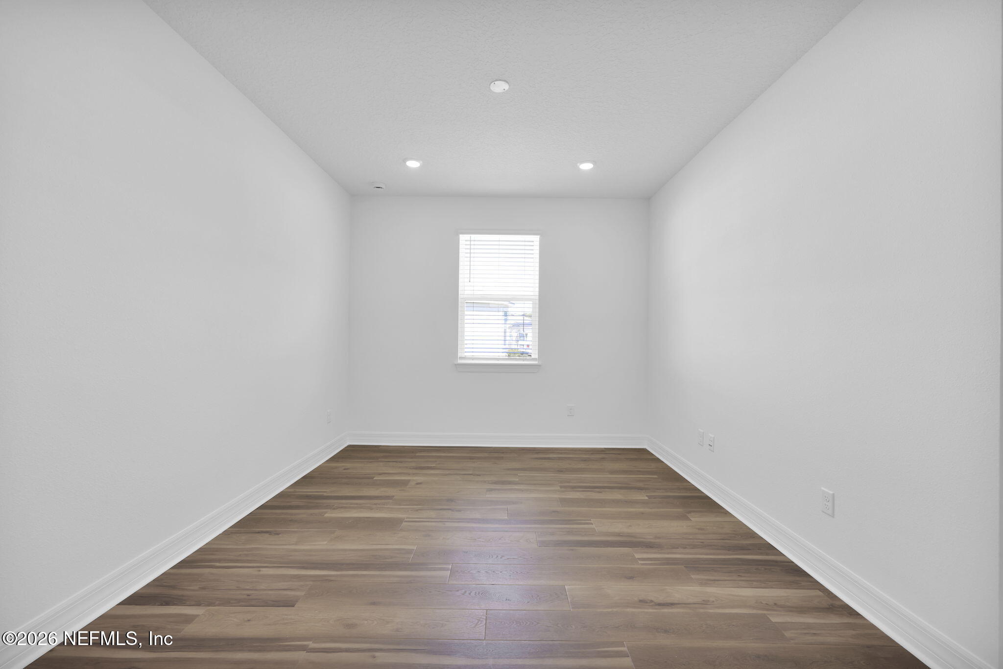 4896 Shell Crk Trail Jacksonville, FL 32226 - Photo 23 of 27 a view of empty room with wooden floor and fan