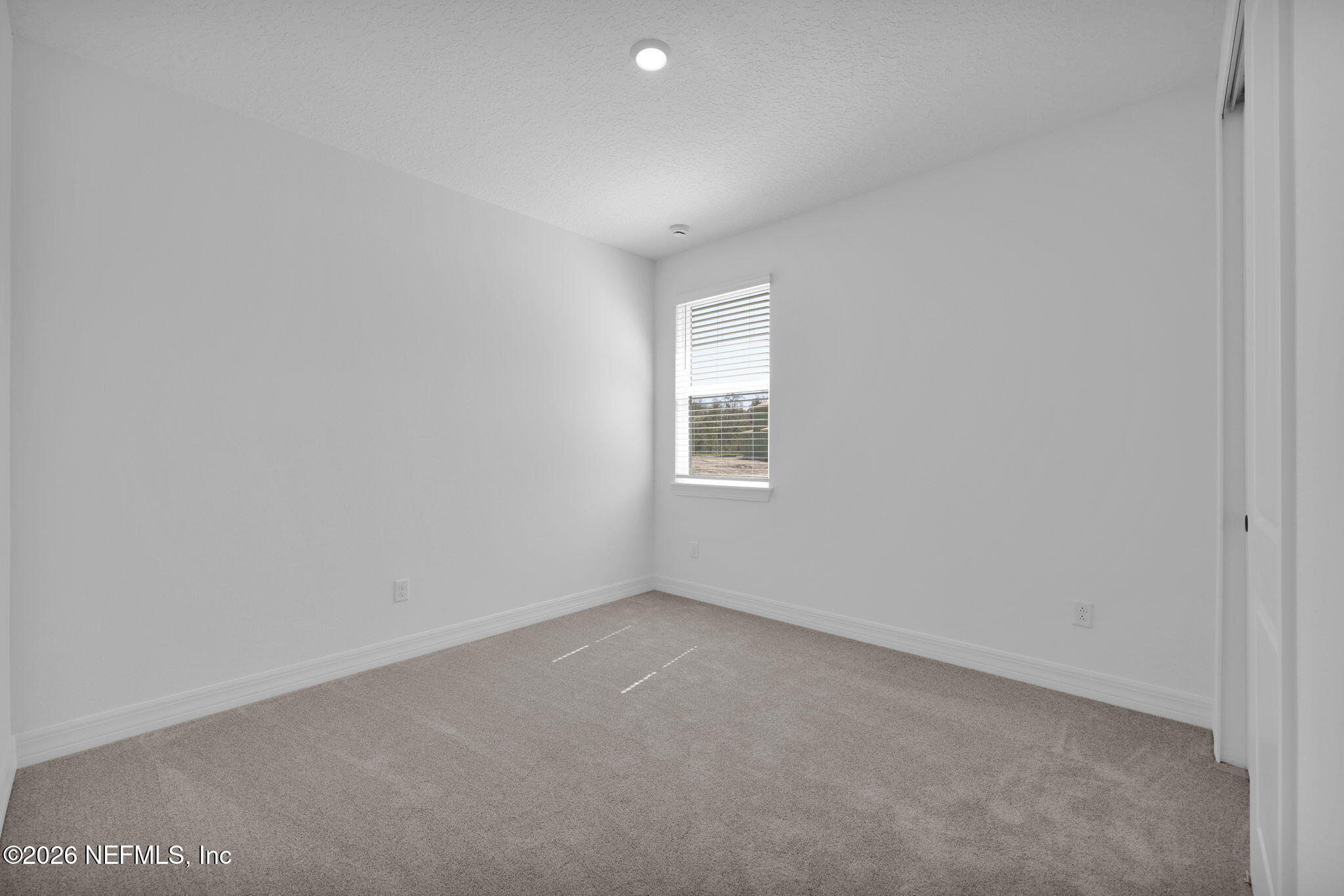 4896 Shell Crk Trail Jacksonville, FL 32226 - Photo 24 of 27 an empty room with a window