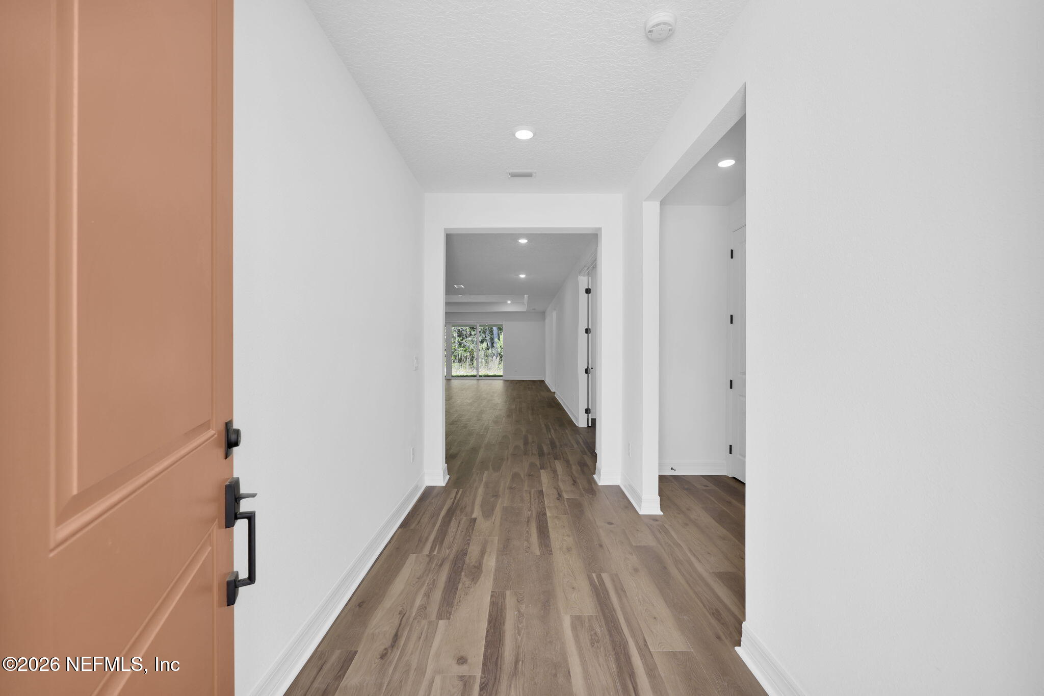 4896 Shell Crk Trail Jacksonville, FL 32226 - Photo 4 of 27 a view of a hallway with wooden floor