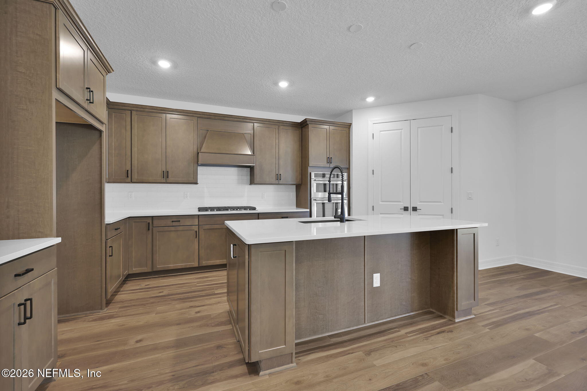 4896 Shell Crk Trail Jacksonville, FL 32226 - Photo 6 of 27 a kitchen with stainless steel appliances granite countertop a sink a stove and a refrigerator