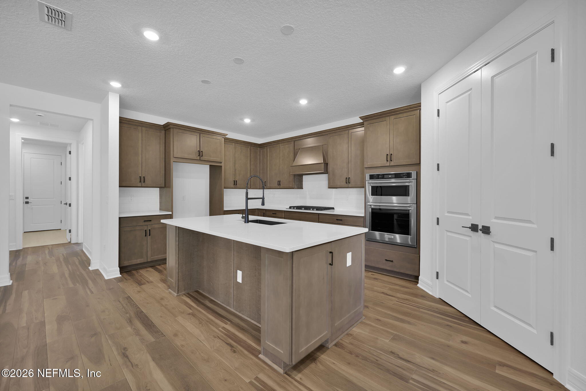 4896 Shell Crk Trail Jacksonville, FL 32226 - Photo 7 of 27 a large kitchen with stainless steel appliances a sink and cabinets