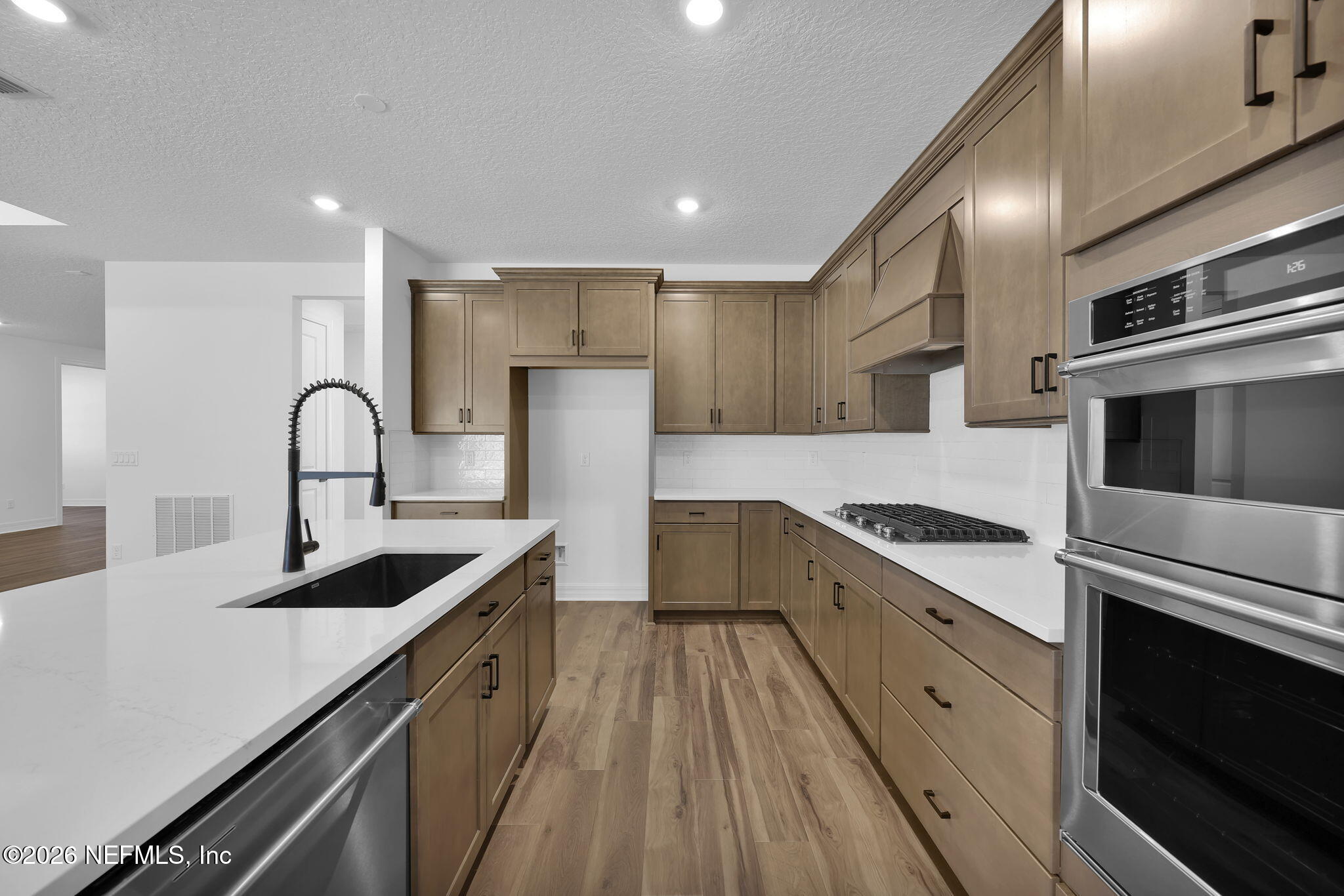 4896 Shell Crk Trail Jacksonville, FL 32226 - Photo 8 of 27 a kitchen with granite countertop a stove and a sink