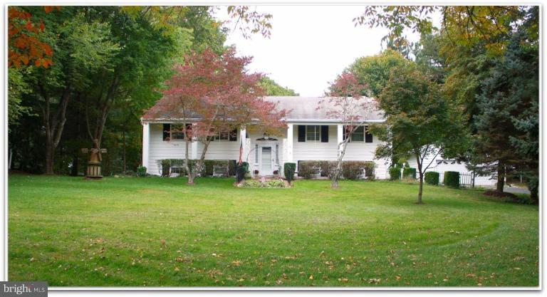 a view of a house with a back yard