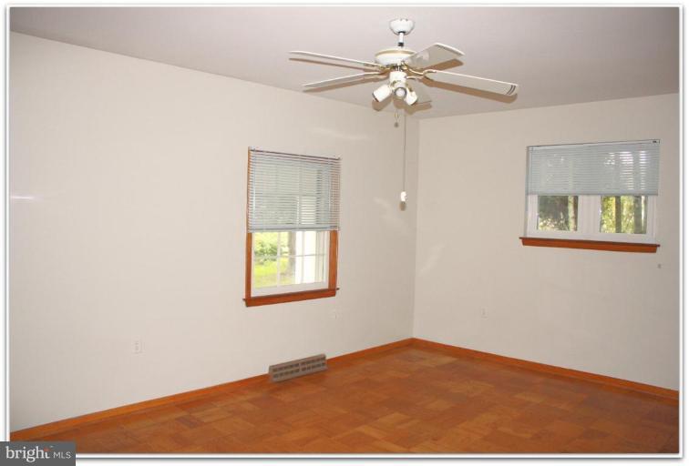 3115 Holland Cliffs Road Huntingtown, MD 20639 - Photo 12 of 13 a view of an empty room with a window