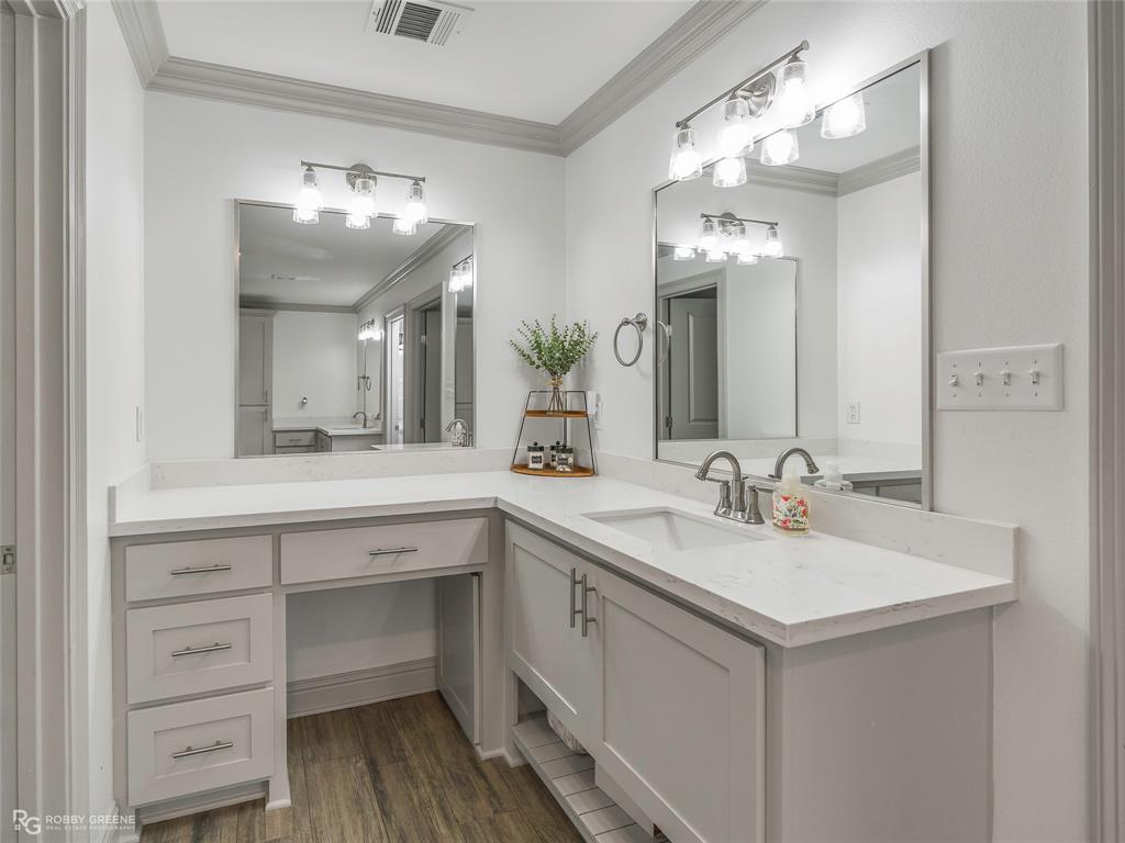 396 Collinswood Road Stonewall, LA 71078 - Photo 29 of 32 a bathroom with a sink vanity and a mirror