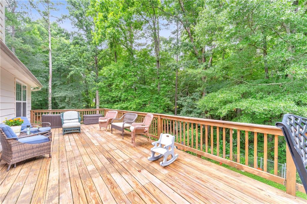 587-j B J B Owens Road Bethlehem, GA 30620 - Photo 7 of 99 a view of balcony with couch and chairs