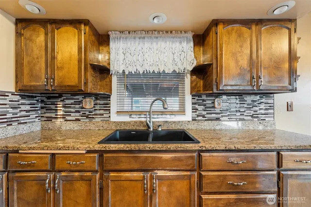 a view of a storage & utility room with a sink