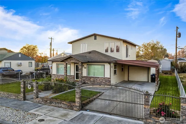 a front view of a house with garden