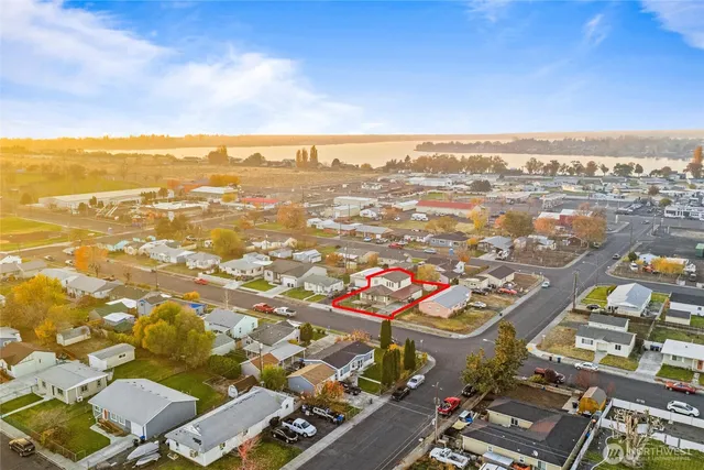 an aerial view of residential houses with outdoor space