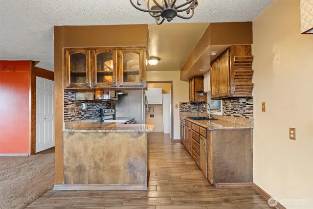 a kitchen with a stove and a sink
