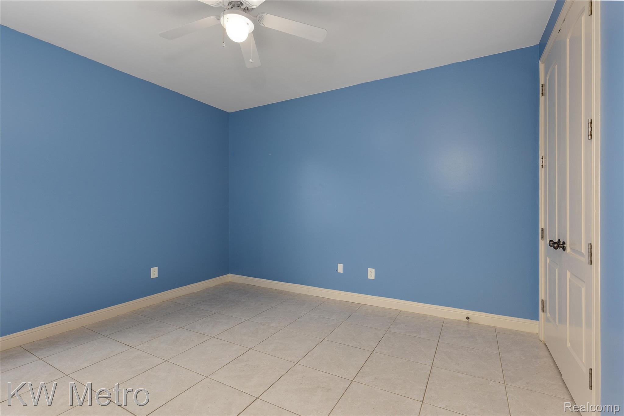 65884 Windrose Court Ray, MI 48096 - Photo 59 of 82 1st floor bedroom featuring ceiling fan and light tile patterned flooring
