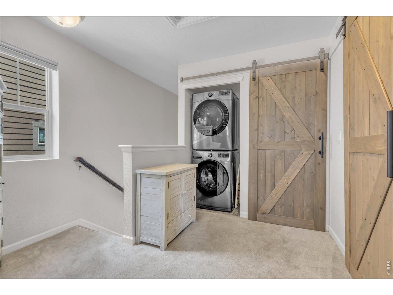 69 Quail Road Longmont, CO 80501 - Photo 16 of 25 New washer & dryer, just behind custom barn door.