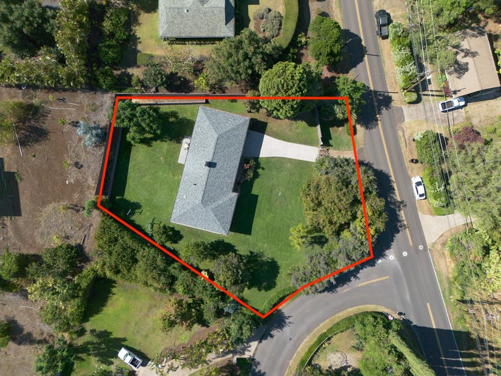 1875 Lower Kula Road Kula, HI 96790 - Photo 1 of 36 an aerial view of a house with a yard and a large pool