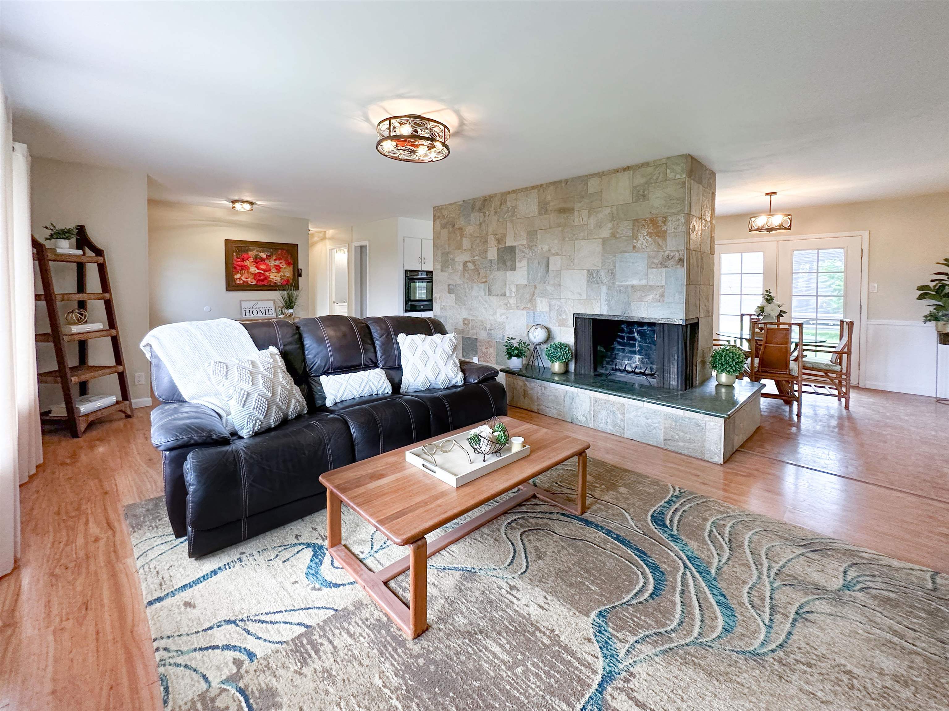 1875 Lower Kula Road Kula, HI 96790 - Photo 14 of 36 a living room with furniture and a fireplace