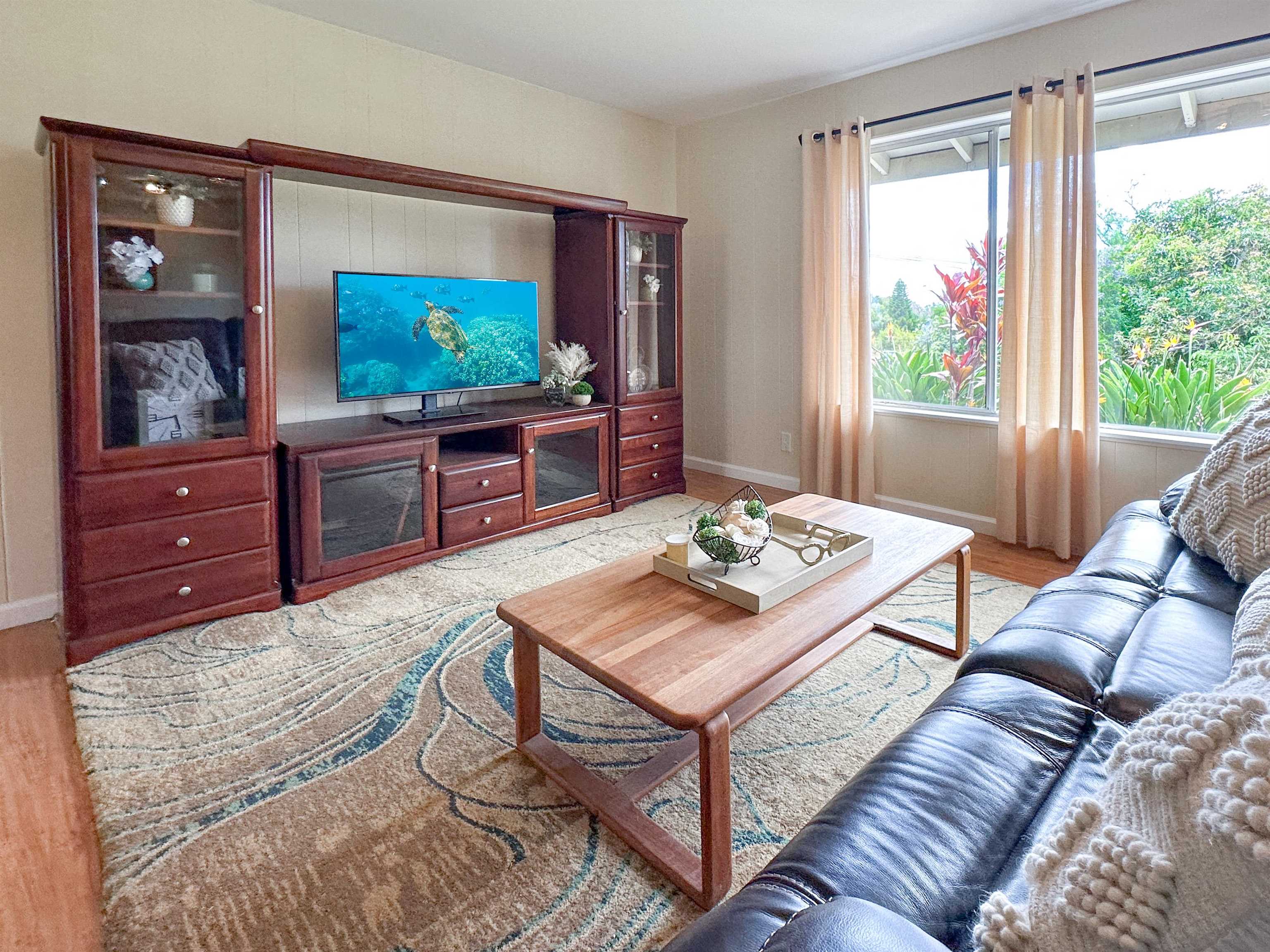 1875 Lower Kula Road Kula, HI 96790 - Photo 15 of 36 a living room with furniture and a flat screen tv
