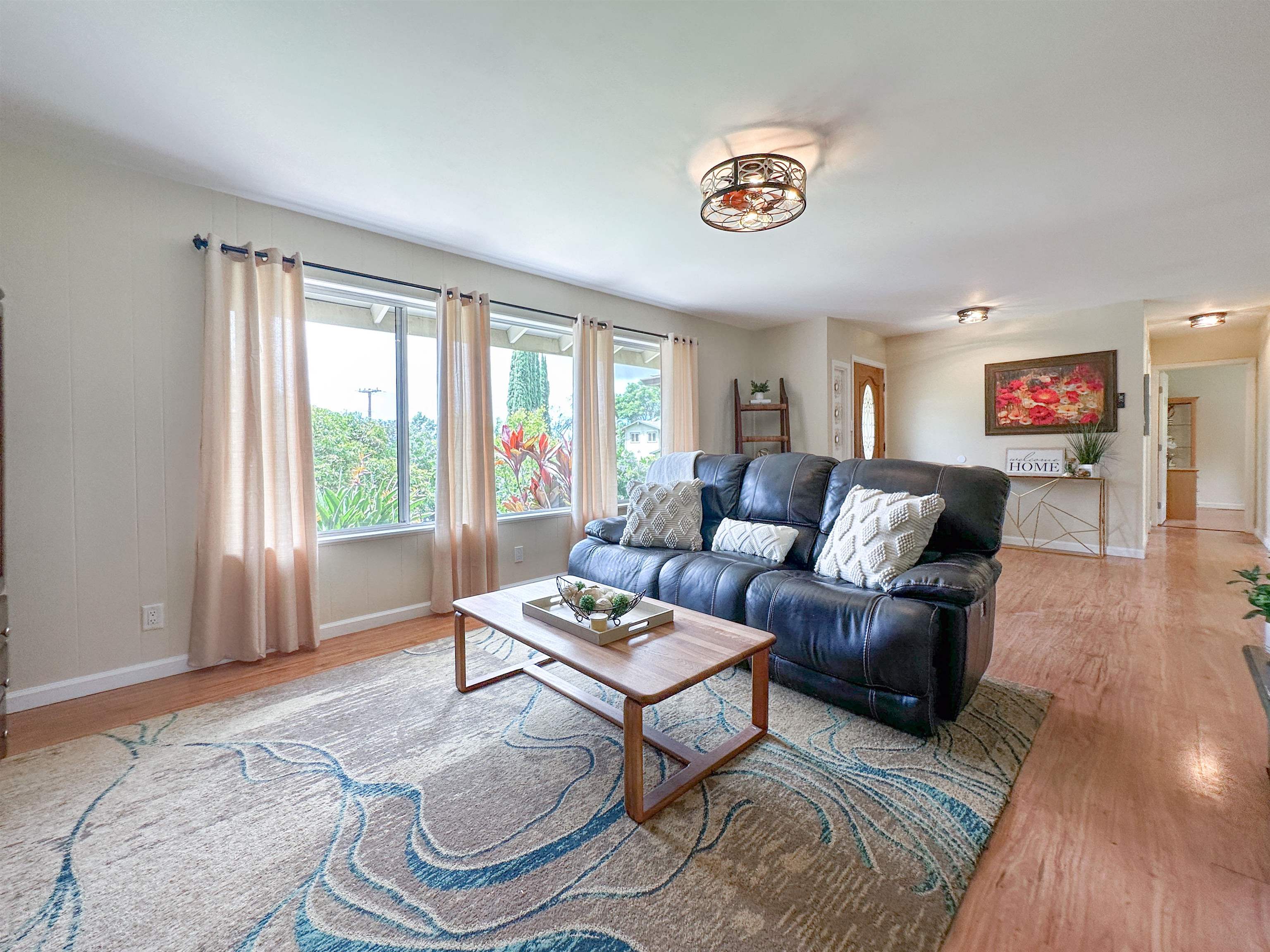 1875 Lower Kula Road Kula, HI 96790 - Photo 17 of 36 a living room with furniture and a large window