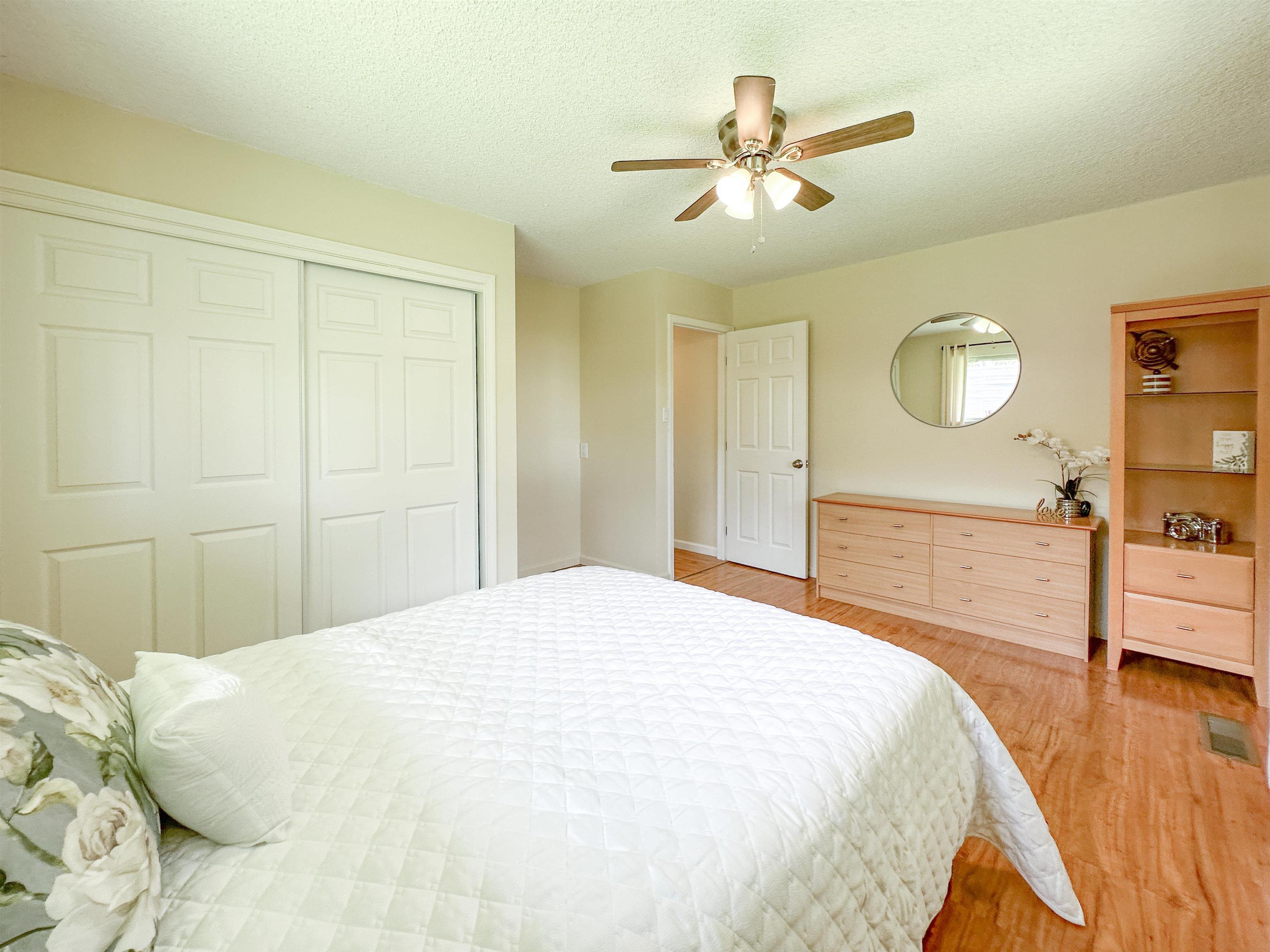 1875 Lower Kula Road Kula, HI 96790 - Photo 24 of 36 a bedroom with a bed and a chandelier