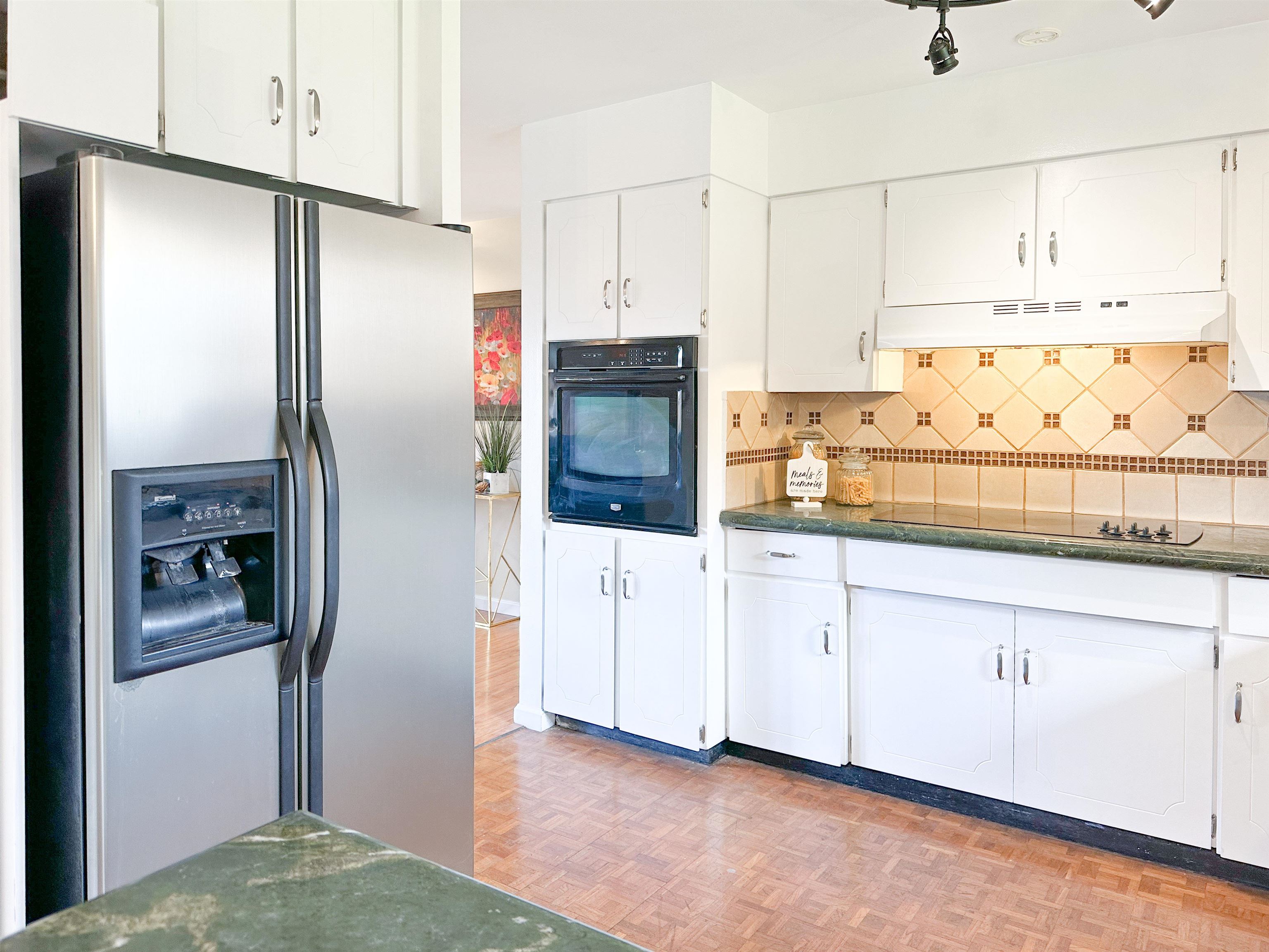 1875 Lower Kula Road Kula, HI 96790 - Photo 3 of 36 a kitchen with stainless steel appliances a refrigerator sink and cabinets